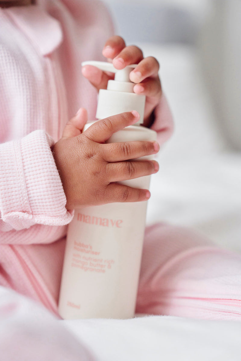 baby hands on bottle