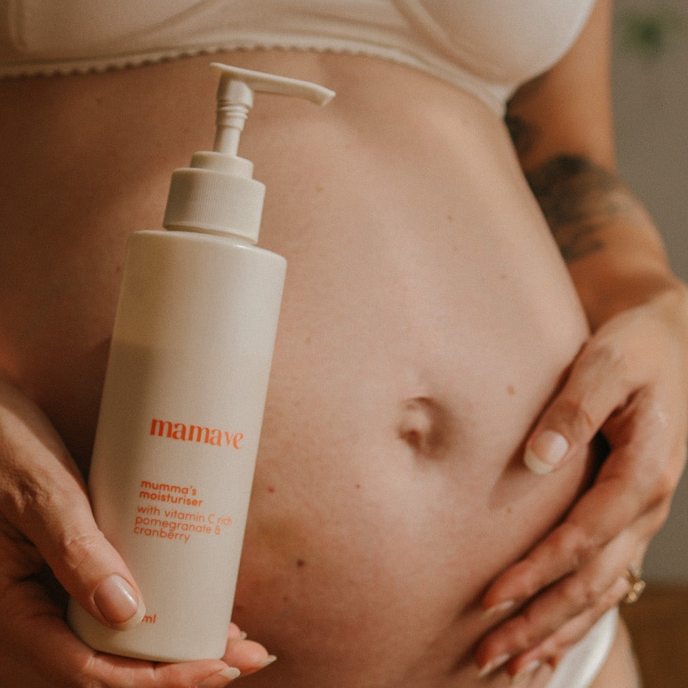 mumma's moisturiser held in front of pregnant tummy